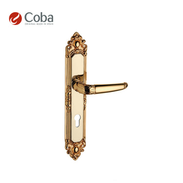 Bronces Coba 610 Handle Set in Old Antique Brass Finish, made in Spain, featuring an ornate design with a coordinated plate.