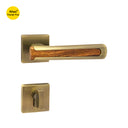 Khas Triumph Plus A14-1686 door handle set with rosette in Matt Antique Brass and wood finish, featuring a modern-rustic design and wood insert grip.