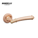 Mandelli 1511 Aurora door handle in rose gold finish, featuring intricate design details and crafted from durable solid brass.