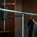 Referencing CLOTH LIFTER 1.jpg, a grey pull-down wardrobe lift is extended outward and downward in a dark wood closet, holding a grey suit jacket on a hanger. CLOTH LIFTER 2.jpg shows a straight-on view of the extended lift mechanism inside the cabinet. CLOTH LIFTER 3.jpg provides a close-up of the adjustable top bar and central T-connector where the pull handle attaches. CLOTH LIFTER 4.jpg illustrates a diagram of the side bracket, showing the pull-down arm extending to a maximum angle of 90 degrees. CLOTH
