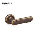Mandelli 1641 Cocò door handle in matte bronze finish, crafted with precision in Italy, displaying intricate detailing and solid brass construction.