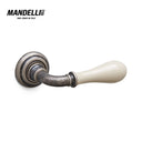 Mandelli 641 Doge door handle, featuring an elegant antique chrome finish with a smooth ceramic grip, crafted in Italy.