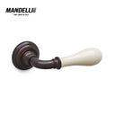 Mandelli 641 Doge door handle in antique bronze and ceramic, reflecting luxury and craftsmanship, ideal for enriching home interiors.
