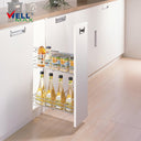 Referencing Drawer baskets PTJ009 1.jpg, a detailed schematic line drawing illustrates the two-tier wire basket structure and its side-mounted sliding tracks. Additionally, Drawer baskets PTJ009.jpg shows the gleaming chrome organizer pulled out from a slim white base cabinet, neatly storing tall bottles of oil and vinegar on the bottom tier, and canned goods on the top tier.
