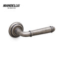 Mandelli 1341 Hartù door handle in antique chrome finish, intricately crafted in Italy with elegant, timeless design.