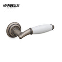 Mandelli 1201 Melody door handle in antique chrome and ceramic, showcasing traditional Italian craftsmanship and unique style.