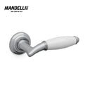 Mandelli 1201 Melody door handle in polished chrome and white ceramic, illustrating the union of modern design and traditional Italian craftsmanship.