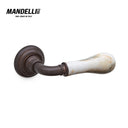 Mandelli 8011 Naxos door handle in antique bronze with White Calacatta marble, showcasing premium Italian craftsmanship and design.