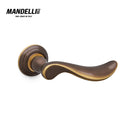 Mandelli 1211 Norma door handle in polished bronze, highlighting smooth lines and luxury craftsmanship.