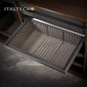 Referencing RATTAN BASKET 1.jpg, a pull-out grey rattan basket in a dark wood wardrobe holds neatly folded striped and textured dark clothing. RATTAN BASKET 2.jpg shows the empty grey PE imitation rattan basket pulled out from the closet shelf. RATTAN BASKET 3.jpg displays a graphic showing the internal mechanisms of the silent damping guide rail with orange arrows indicating smooth movement. RATTAN BASKET 4.jpg provides a close-up highlighting the frosted grey space aluminum frame edge and the woven rattan