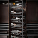 Referencing REVOLVING SHOE RACK .jpg, a split image shows the grey multi-layer rotating shoe rack installed in a dark wardrobe on the left, and being manually rotated by hands on a white background on the right. REVOLVING SHOE RACK 1.jpg displays the rack angled outward in a dark wood closet, showing high heels and flats stored on its staggered leather-lined shelves. REVOLVING SHOE RACK 2.jpg gives a slim side-profile view of the revolving rack inside the wardrobe. REVOLVING SHOE RACK 3.jpg provides a close