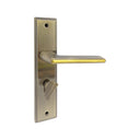 S1245H1775 door handle set on a rectangular backplate in an AB/GP finish, featuring a lever with a bright gold inlay and a privacy turn knob.