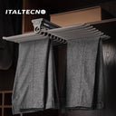 Referencing TOP MOUNTED TROUSER RACK 1.jpg, the top-mounted rack is extended from under a closet shelf, displaying neatly hung grey trousers. TOP MOUNTED TROUSER RACK 2.jpg provides a close-up of the front pull handle and the textured hanging rods. TOP MOUNTED TROUSER RACK 3.jpg offers a macro view of the metal hooks and the non-slip covering on the trouser bars. TOP MOUNTED TROUSER RACK 4.jpg shows an isolated view of the complete rack assembly with 20 individual hanger arms. TOP MOUNTED TROUSER RACK.jpg d