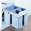 Wellmax CLG025B silver grey three-bin slide garbage bin system, showing one large and two small plastic buckets in a pull-out metal frame mounted inside a kitchen cabinet.