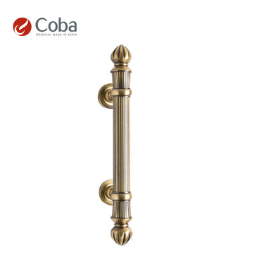 Bronces Coba 1012 Pull Handle in OLD ANTIQ BRASS Finish, made in Spain, featuring a traditional design and solid brass construction.