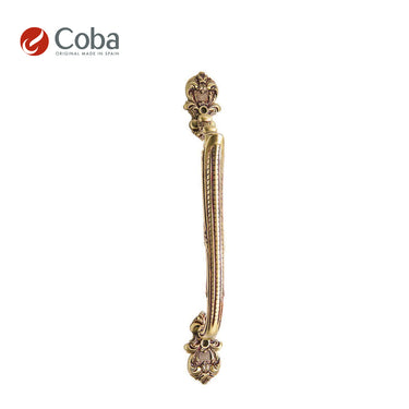 Bronces Coba 1022 Pull Handle in OLD ANTIQUE BRASS Finish, made in Spain, featuring an ornate design and solid brass construction.