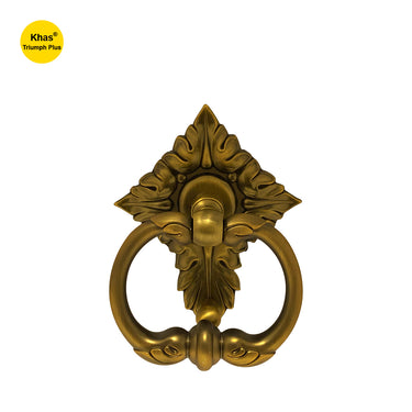 Khas Triumph Plus 2015 Door Knocker in MAE finish, featuring a bold decorative backplate with a sturdy knocker ring.

