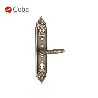 Bronces Coba 350-S Handle Set on Plate in Old Antique Brass Finish, made in Spain, featuring intricate vintage detailing.