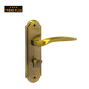 Khas Trend Plus 86M208-267 Door Handle Set in AB finish, featuring a modern curved design with an antique brass tone.