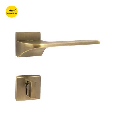 Khas Triumph Plus A14-1601 door handle set with rosette in matt antique brass finish, featuring a sleek curved design and premium build quality.