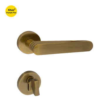 Khas Triumph Plus A32-1711 door handle set with rosette in antique brass finish, featuring a layered design and ergonomic handle for easy grip.