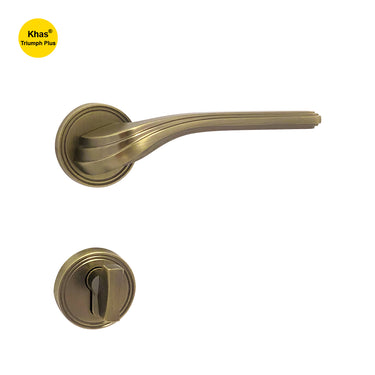 Khas Triumph Plus A65-1622 door handle set with rosette in matt antique brass finish, featuring a classic design with elegant ridges and smooth operation.