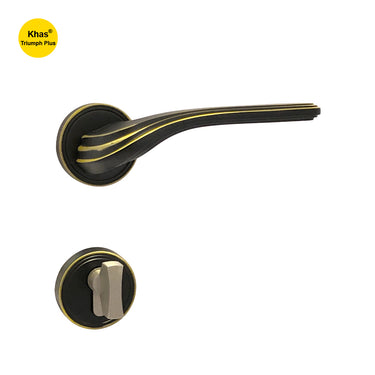 Khas Triumph Plus A65-1622 door handle set with rosette in oil-rubbed bronze finish, featuring golden accents and a curved, ridged design for a vintage look.
