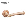 Mandelli 1511 Aurora door handle in rose gold finish, featuring intricate design details and crafted from durable solid brass.