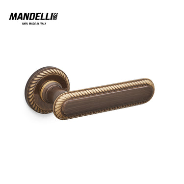 Mandelli 1641 Cocò door handle in a deep bronze finish, showcasing detailed craftsmanship and solid brass material, made in Italy.