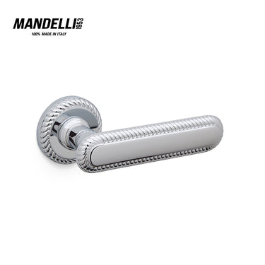 Mandelli 1641 Cocò door handle in polished chrome finish, crafted in Italy, featuring elegant ridging and solid brass construction.