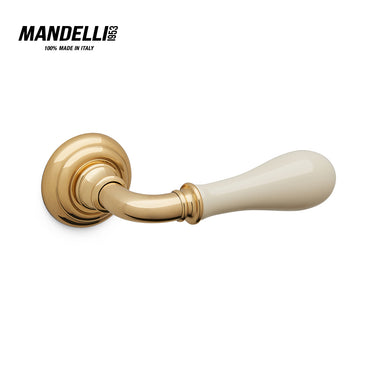 Mandelli 641 Doge door handle in polished brass/ceramic, exemplifying luxury and craftsmanship, ideal for enhancing home interiors.
