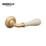 Mandelli 641 Doge door handle in polished brass/ceramic, exemplifying luxury and craftsmanship, ideal for enhancing home interiors.