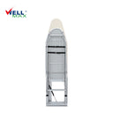 Referencing Folding Ironing Board HZ040C 3.jpg, the Wellmax folding ironing board is deployed from a dark wood wardrobe, showing its sturdy grey iron frame and supporting leg. Folding Ironing Board HZ040C 2.jpg displays the underside of the ironing board when folded up, highlighting the high-density through-hole network and structural reinforcement. Folding Ironing Board HZ040C 1.jpg shows a side profile of the folded ironing board, illustrating its compact, space-saving vertical position. Folding Ironing B