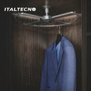 An Italtecno wardrobe storage accessory is mounted to the top of a dark wood cabinet, featuring a curved, revolving metal frame with spacing pegs, currently holding a blue suit jacket on a hanger.