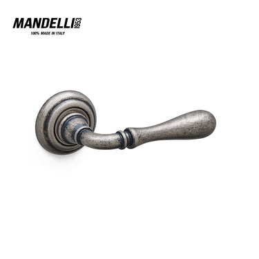 Mandelli 1421 Gou door handle in antique chrome finish, showcasing intricate craftsmanship and a timeless design, made in Italy.