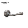 Mandelli 1421 Gou door handle in antique chrome finish, showcasing intricate craftsmanship and a timeless design, made in Italy.