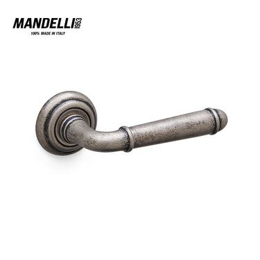 Mandelli 1341 Hartù door handle in antique chrome finish, intricately crafted in Italy with elegant, timeless design.