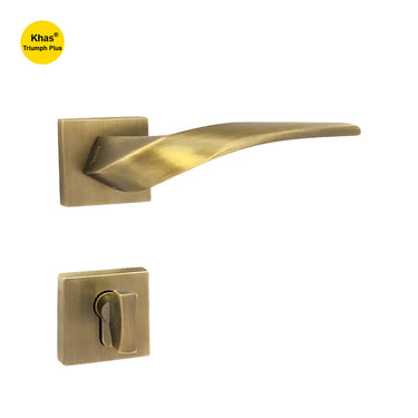 Khas Triumph Plus KH-R011 door handle set with rosette in matt antique brass finish, featuring a sleek curved design and smooth ergonomic grip.