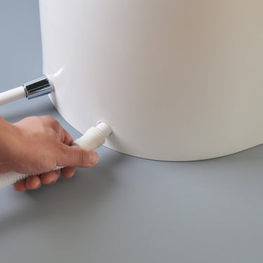 Khas white foot washer basin, featuring an ergonomic, electricity-free design for wudu and daily foot cleaning.
