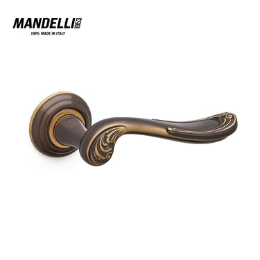 Mandelli 1021 Lord door handle in a rich bronze finish, featuring detailed craftsmanship and solid brass construction, made in Italy.