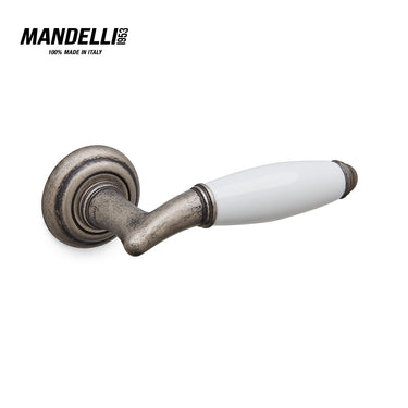 Mandelli 1201 Melody door handle in antique chrome and ceramic, showcasing traditional Italian craftsmanship and unique style.