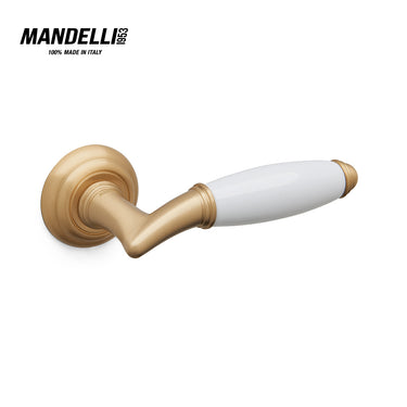 Mandelli 1201 Melody door handle in satin brass and ceramic, embodying Italian craftsmanship and sophisticated design.