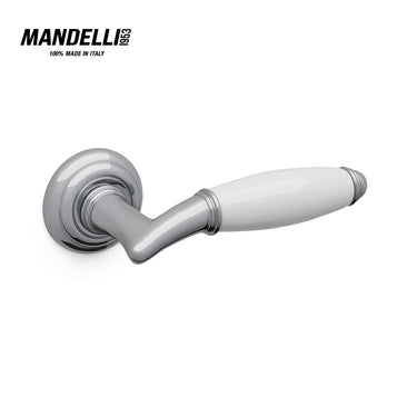 Mandelli 1201 Melody door handle in polished chrome and white ceramic, illustrating the union of modern design and traditional Italian craftsmanship.