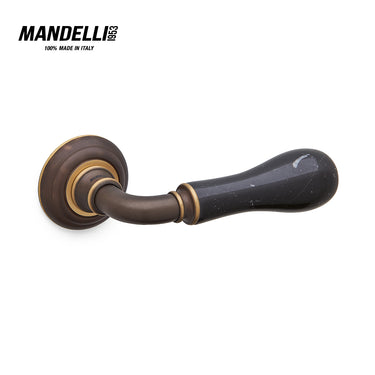 Mandelli 8011 Naxos door handle in matt bronze with Black Marquinia marble, showcasing fine Italian craftsmanship.