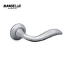 Mandelli 981 Plissé door handle in polished chrome, featuring a unique sculptural design for a sleek, modern feel, made in Italy.