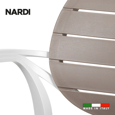 Referencing Palma Bianco Tortora 1.jpg, an angled view of the Nardi Palma armchair shows its white frame and tortora (taupe) slatted seat and backrest against a white background. Palma Bianco Tortora 2.jpg displays a rear-angled view of the chair, highlighting the rounded, slatted backrest and the 'Made in Italy' graphic. Palma Bianco Tortora 3.jpg provides a close-up of the textured tortora slats on the backrest and where they meet the white armrest frame. Palma Bianco Tortora.jpg shows a straight-on front