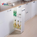 Referencing Pull out basket PTJ009I 1.jpg, a detailed schematic line drawing illustrates the two-tier wire basket structure and its side-mounted sliding tracks. Additionally, Pull out basket PTJ009I.jpg shows the gleaming chrome organizer pulled out from a slim white base cabinet, neatly storing tall bottles, drinks, and cups on its shelves.