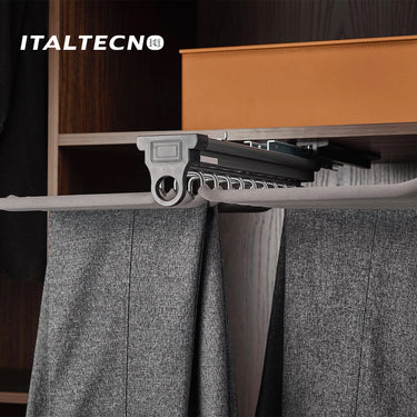 Referencing TOP MOUNTED TROUSER RACK 1.jpg, the top-mounted rack is extended from under a closet shelf, displaying neatly hung grey trousers. TOP MOUNTED TROUSER RACK 2.jpg provides a close-up of the front pull handle and the textured hanging rods. TOP MOUNTED TROUSER RACK 3.jpg offers a macro view of the metal hooks and the non-slip covering on the trouser bars. TOP MOUNTED TROUSER RACK 4.jpg shows an isolated view of the complete rack assembly with 20 individual hanger arms. TOP MOUNTED TROUSER RACK.jpg d