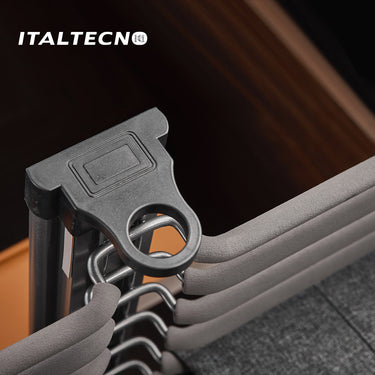Referencing TOP MOUNTED TROUSER RACK 1.jpg, the top-mounted rack is extended from under a closet shelf, displaying neatly hung grey trousers. TOP MOUNTED TROUSER RACK 2.jpg provides a close-up of the front pull handle and the textured hanging rods. TOP MOUNTED TROUSER RACK 3.jpg offers a macro view of the metal hooks and the non-slip covering on the trouser bars. TOP MOUNTED TROUSER RACK 4.jpg shows an isolated view of the complete rack assembly with 20 individual hanger arms. TOP MOUNTED TROUSER RACK.jpg d