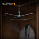 Referencing Top Mounted 360 Degree Rotating Clothes Rack 1.jpg, the grey carousel clothes rack is mounted to the top of a dark wood corner cabinet. Top Mounted 360 Degree Rotating Clothes Rack 2.jpg shows a close-up of the central ceiling mount and the rotating bearing mechanism. Top Mounted 360 Degree Rotating Clothes Rack 3.jpg provides a macro view of the metal spacing pegs distributed along the curved outer frame. Top Mounted 360 Degree Rotating Clothes Rack 4.jpg displays a blue suit jacket hanging fro